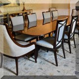 F32. Flame mahogany double pedestal dining table with 14 chairs. Table measures 30”h x 96”w x 46”d 